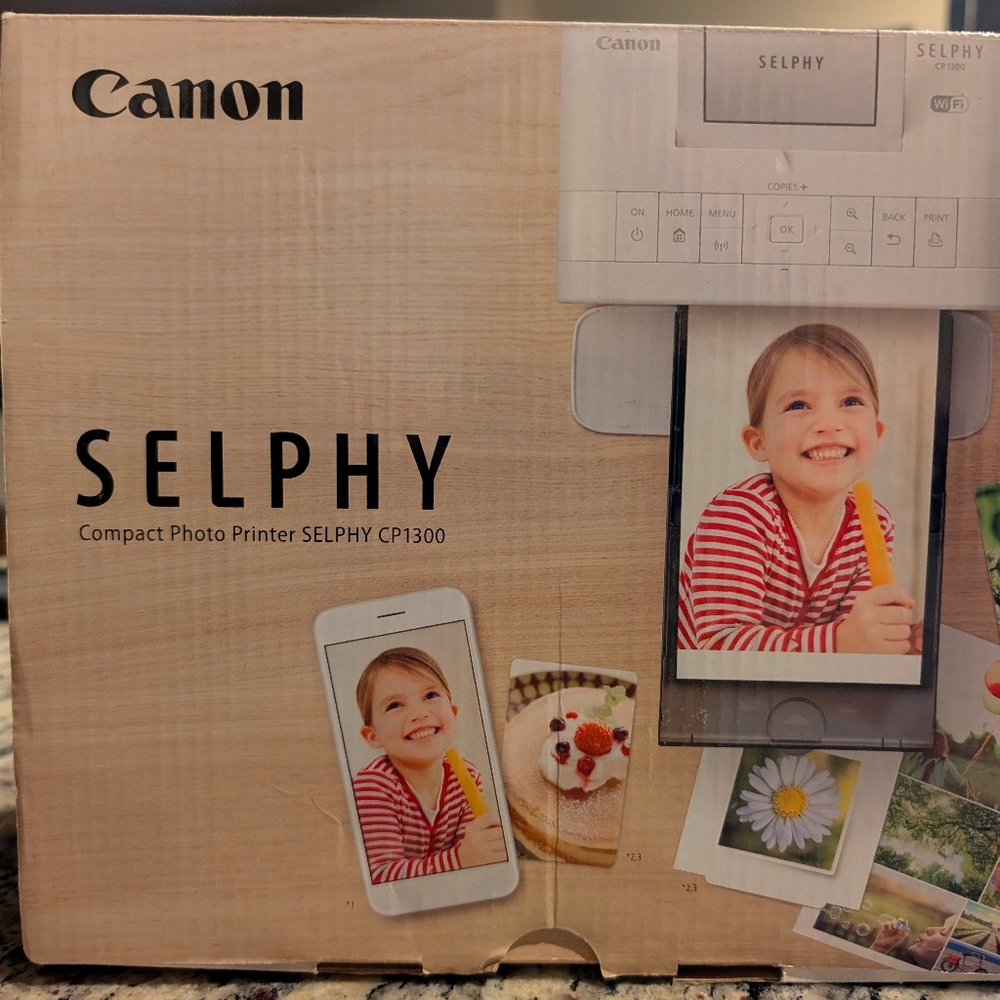 Canon SELPHY CP1300 in White and Black